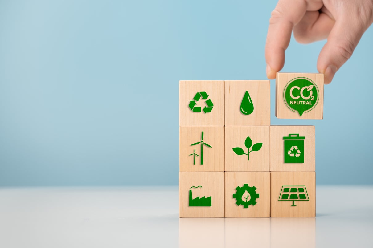 Net zero and carbon neutral concept. Put wooden cubes with green net zero icon. CO2 Net-Zero Emission -Carbon Neutrality concept. renewable energy, co2 emissions reduction, green production